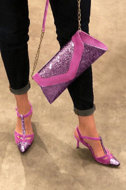 Women's shocking pink and hot pink luxurious elegant clutch for ceremonies, weddings and evenings out. - Worn view